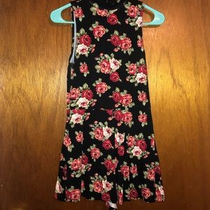Black romper with pink, red, and white roses